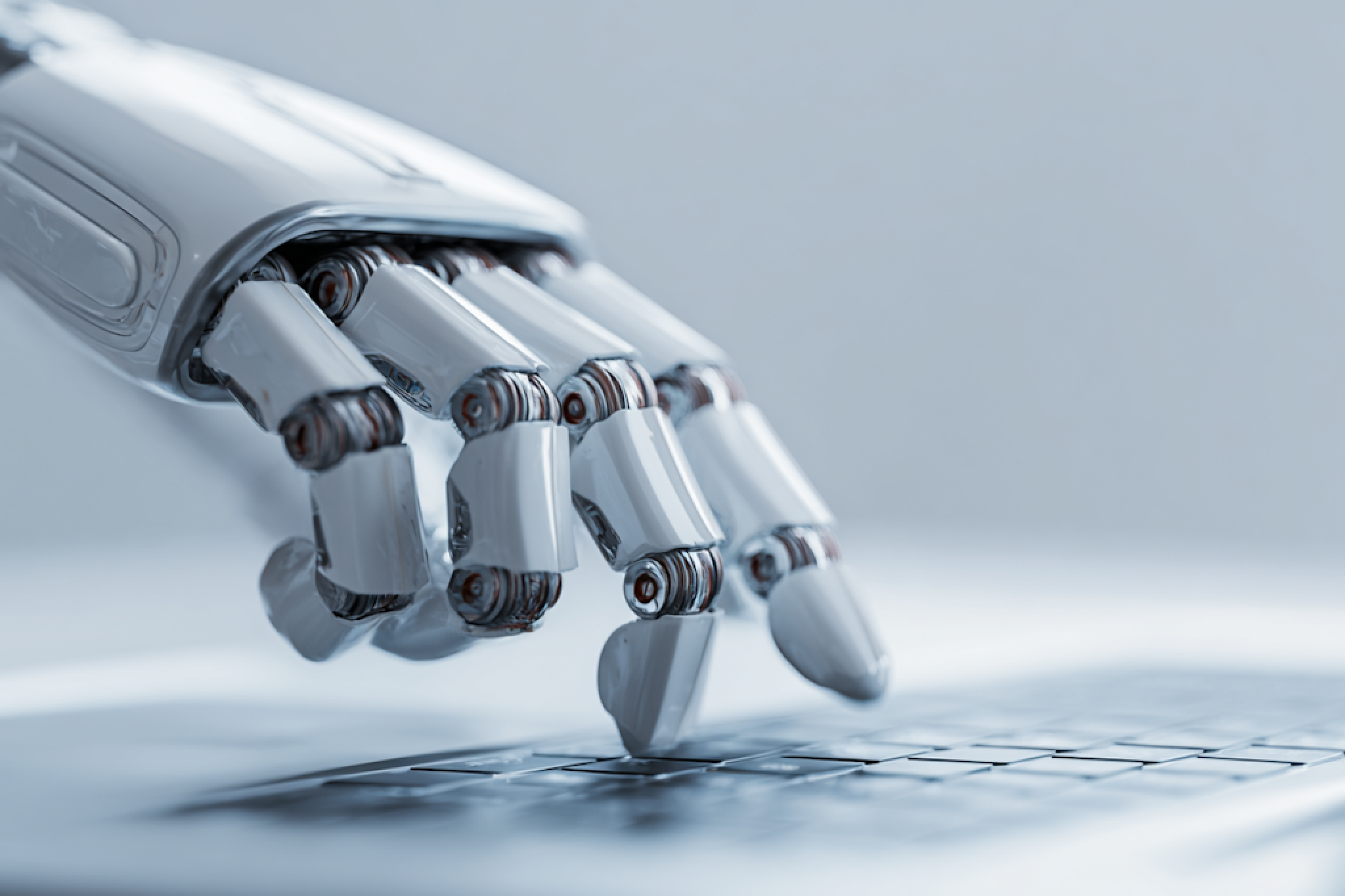 Robotic hand typing on keyboard illustrating modern chatbot automation and AI-powered customer interaction