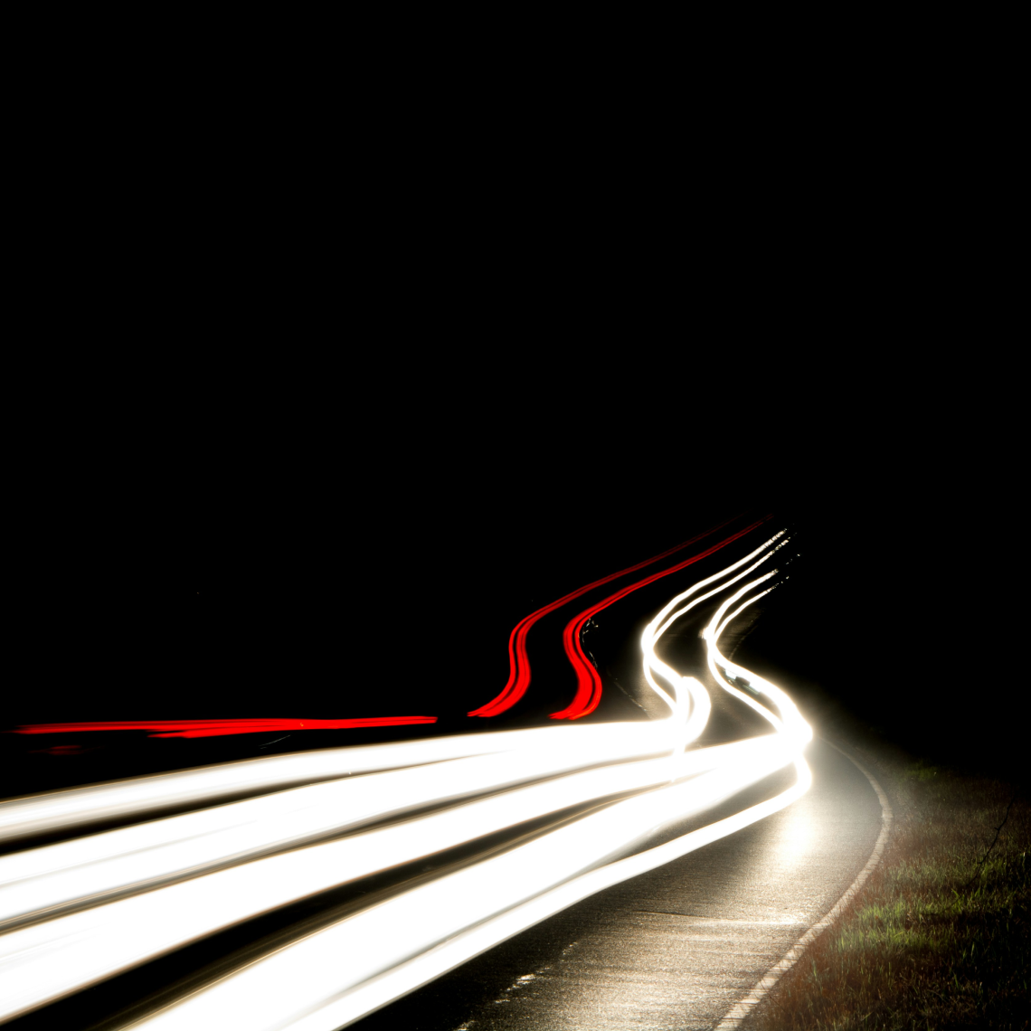 Motion-blurred highway at night showing speed and fast response times