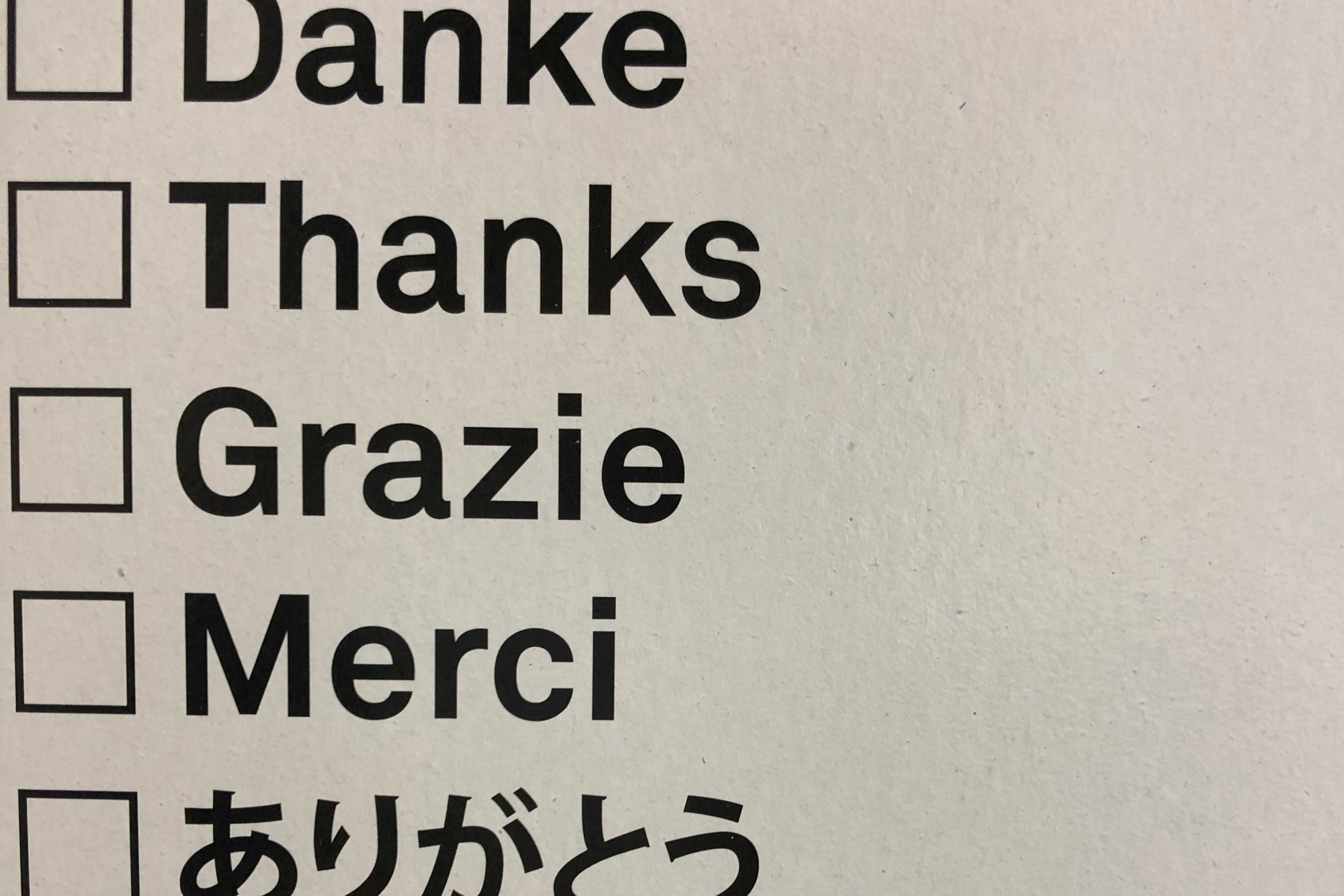 Checklist displaying 'Thank you' in multiple languages including German, Italian, French, and Japanese demonstrating multilingual capabilities