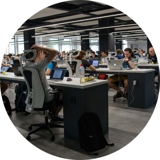 Customer support team working in modern office environment with live chat assistance.