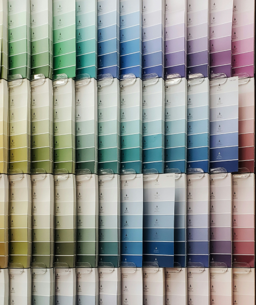 Gradient color samples arranged in rows showing spectrum from green to purple representing product variety and customization